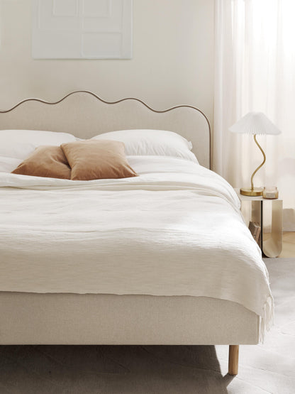 Romarra Upholstered Bed with Wavy Headboard